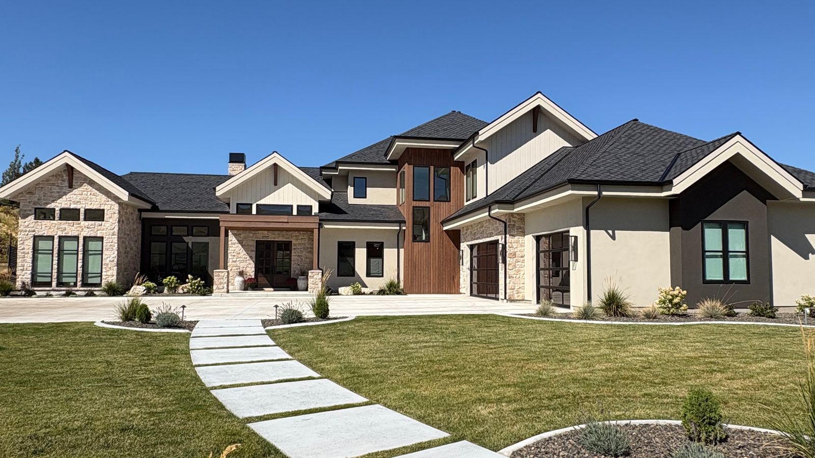 A large stone and wood home in Boise's East End, with a stepping-stone front walk