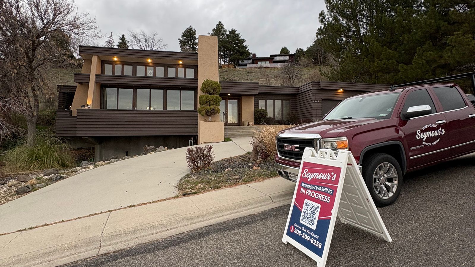 The Seymour's truck and sidewalk sign outside a hillside Boise home